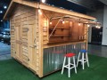 10x10 Cedar Bar Shed divided 60/40. The 40 square feet of Bar includes an 8' bar top and flip up opening, custom shelving, cedar ship lap on the interior and a 24 wood entry door. The 60 square feet of storage has L shaped 16 deep shelves and a 36 wood do